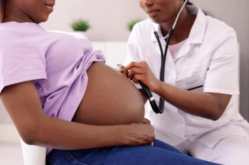 a healthy beginning with a doctor checking pregnant woman