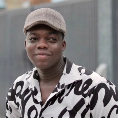 picture showing a young man smiling at his debtor